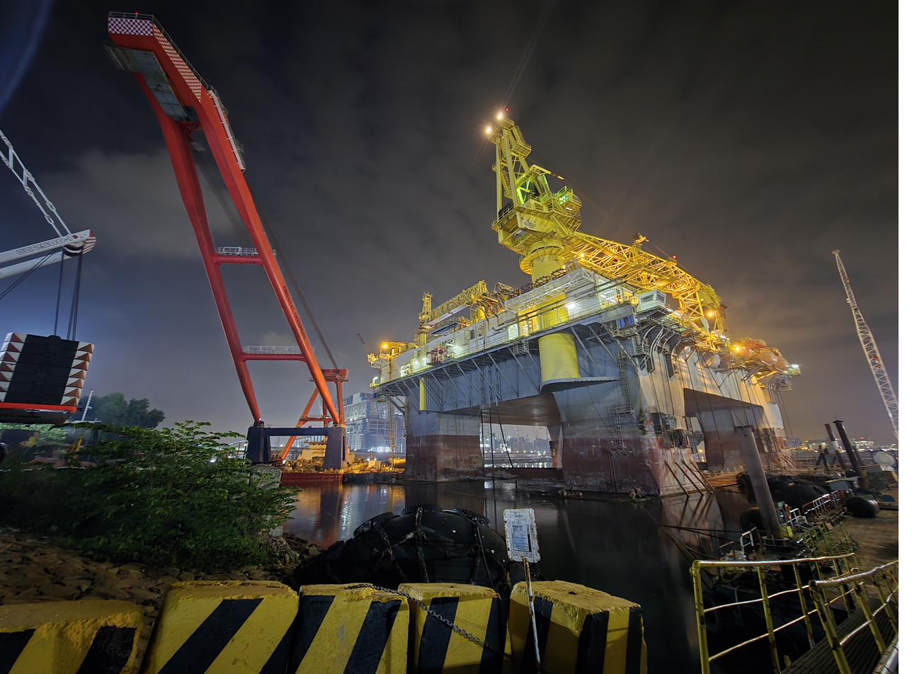 Offshore rig undergoing inspection at a shipyard
